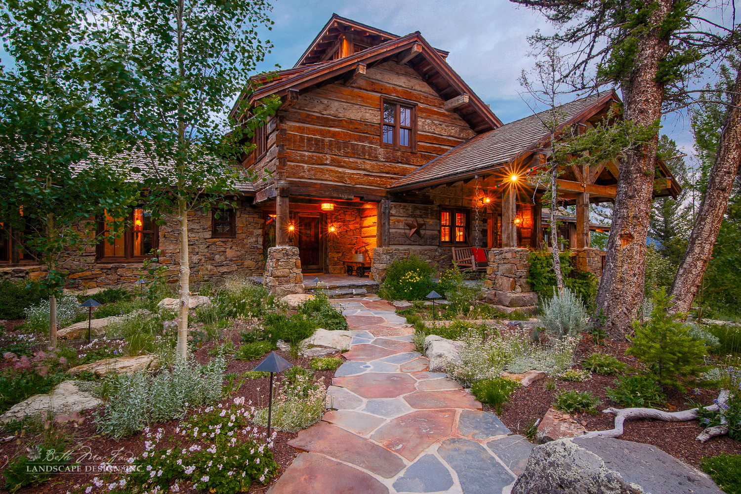 Photo of timber framed home with rock pathways and garden beds
